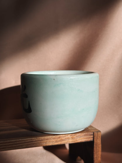 Vela pequena branca e verde - Edição black week